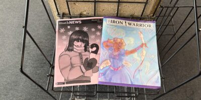mathNEWS and Iron Warrior side by side